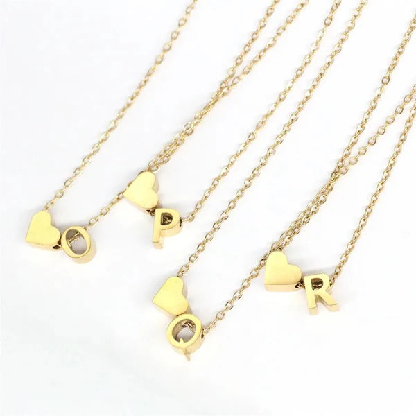 Heart Initial Necklace featuring a delicate heart-shaped charm with custom letter engraving.