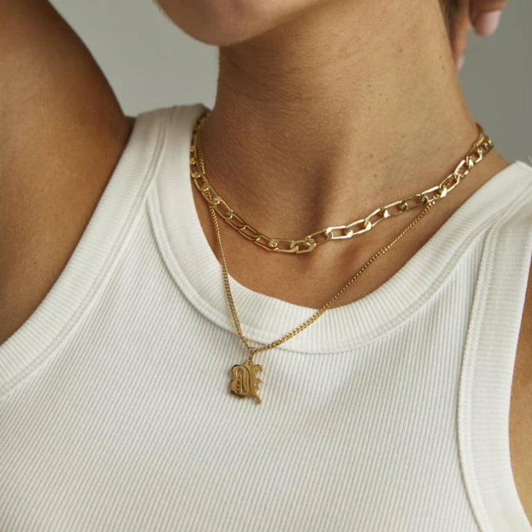 Camille Vintage English Letter Necklace featuring a bold old English initial pendant.

