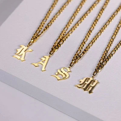 Camille Vintage English Letter Necklace featuring a bold old English initial pendant.

