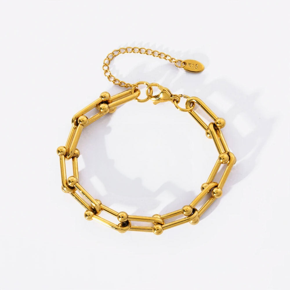 Image of the Celestial Charm Bracelet – an 18K gold stainless steel bracelet with star and moon charms, perfect for cosmic-inspired elegance.

