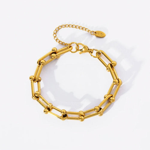 Image of the Celestial Charm Bracelet – an 18K gold stainless steel bracelet with star and moon charms, perfect for cosmic-inspired elegance.

