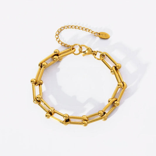 Image of the Celestial Charm Bracelet – an 18K gold stainless steel bracelet with star and moon charms, perfect for cosmic-inspired elegance.

