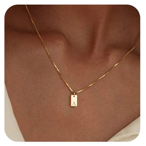 Dainty Tag Necklace featuring a slim, minimalist tag pendant on a delicate chain.

