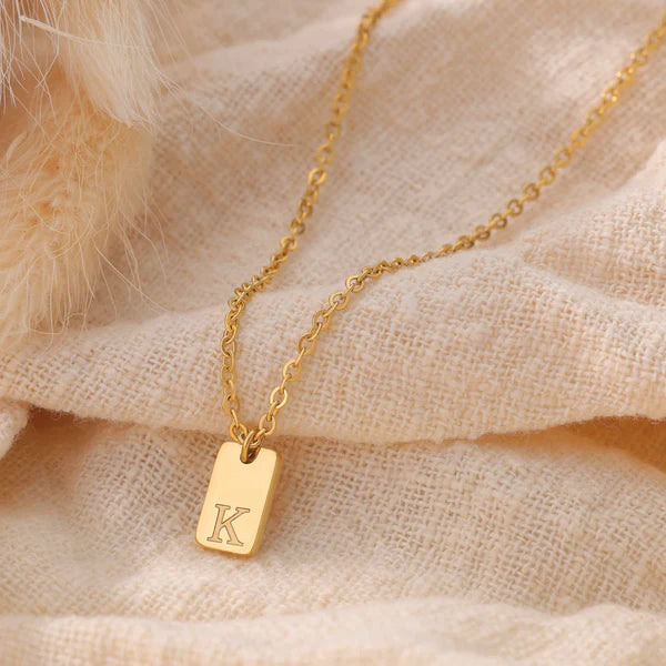Dainty Tag Necklace featuring a slim, minimalist tag pendant on a delicate chain.

