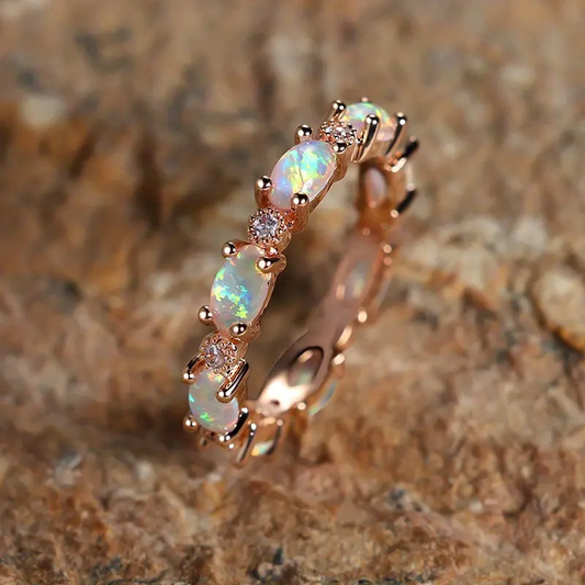 Image of the Eternity Opal Band Ring – a radiant ring with shimmering opals in a continuous band, symbolizing elegance and eternity.

