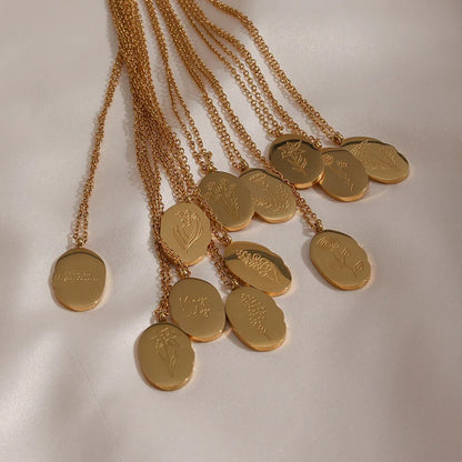 Fleur Oval Coin Necklace featuring a vintage-inspired oval pendant with elegant details.

