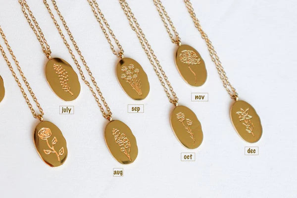 Fleur Oval Coin Necklace featuring a vintage-inspired oval pendant with elegant details.

