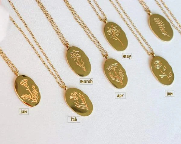 Fleur Oval Coin Necklace featuring a vintage-inspired oval pendant with elegant details.

