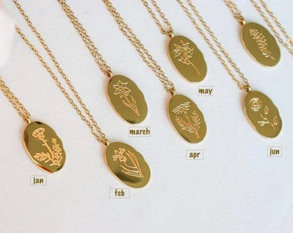Fleur Oval Coin Necklace featuring a vintage-inspired oval pendant with elegant details.

