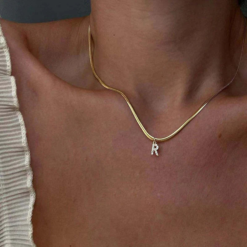 Herringbone Initial Necklace with a stylish chain and personalized initial pendant.

