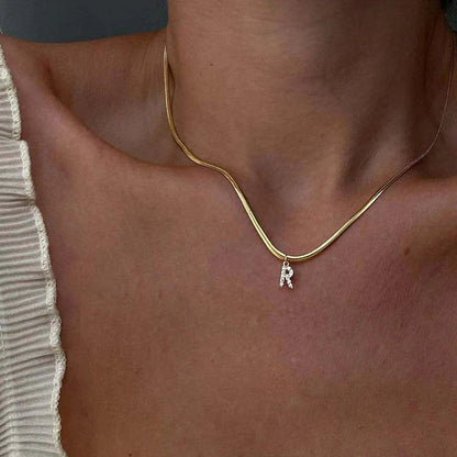 Herringbone Initial Necklace with a stylish chain and personalized initial pendant.

