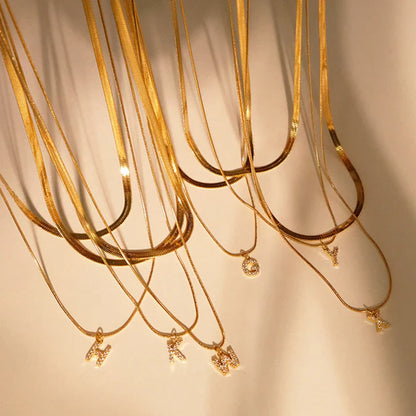 Herringbone Initial Necklace with a stylish chain and personalized initial pendant.

