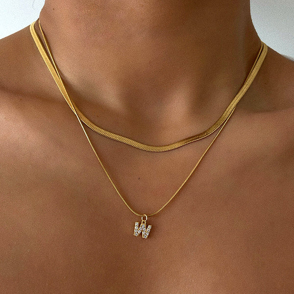 Herringbone Initial Necklace with a stylish chain and personalized initial pendant.

