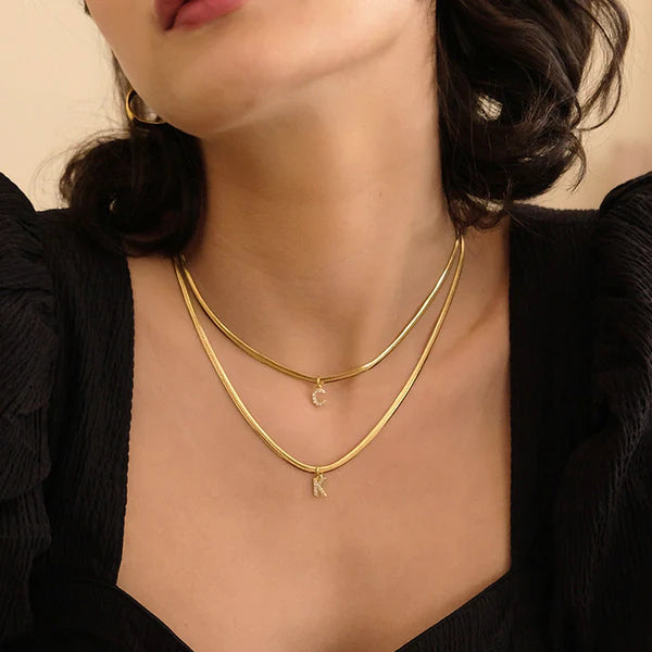 Herringbone Initial Necklace with a stylish chain and personalized initial pendant.

