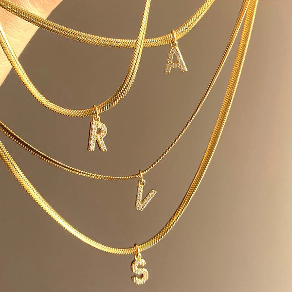 Herringbone Initial Necklace with a stylish chain and personalized initial pendant.

