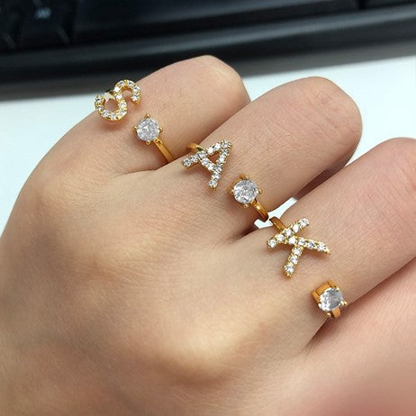 Image of the Initial Ring – a personalized ring featuring a single letter, ideal for adding a unique and elegant touch to any look.

