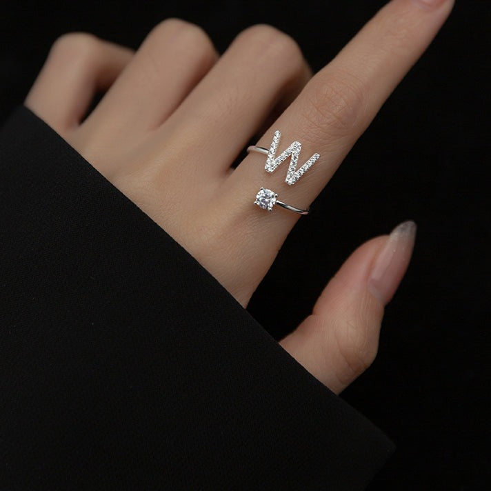 Image of the Initial Ring – a personalized ring featuring a single letter, ideal for adding a unique and elegant touch to any look.

