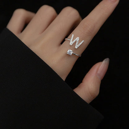 Image of the Initial Ring – a personalized ring featuring a single letter, ideal for adding a unique and elegant touch to any look.

