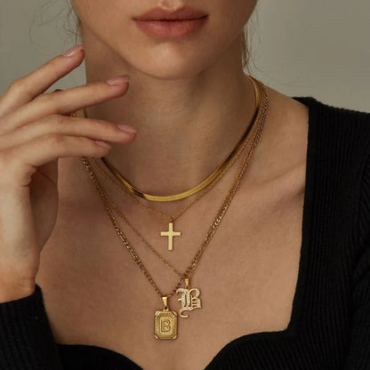 Leila Square Letter Pendant Necklace with a minimalist design and engraved initial.

