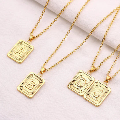 Leila Square Letter Pendant Necklace with a minimalist design and engraved initial.

