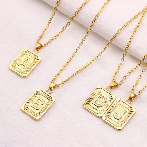 Leila Square Letter Pendant Necklace with a minimalist design and engraved initial.

