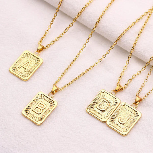 Leila Square Letter Pendant Necklace with a minimalist design and engraved initial.

