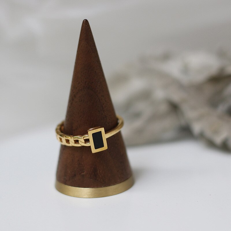 Image of the Onyx Ring – a bold 18K gold stainless steel ring with a striking black onyx stone, ideal for elegant and edgy styles.

