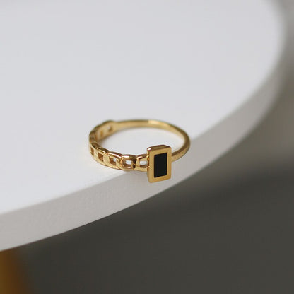 Image of the Onyx Ring – a bold 18K gold stainless steel ring with a striking black onyx stone, ideal for elegant and edgy styles.

