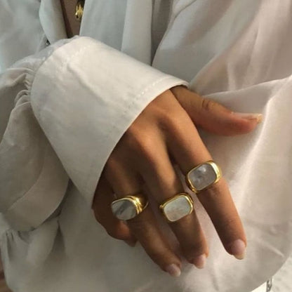 Image of the Opal Ring – a delicate 18K gold stainless steel ring with a luminous opal stone, perfect for adding elegance to any look.

