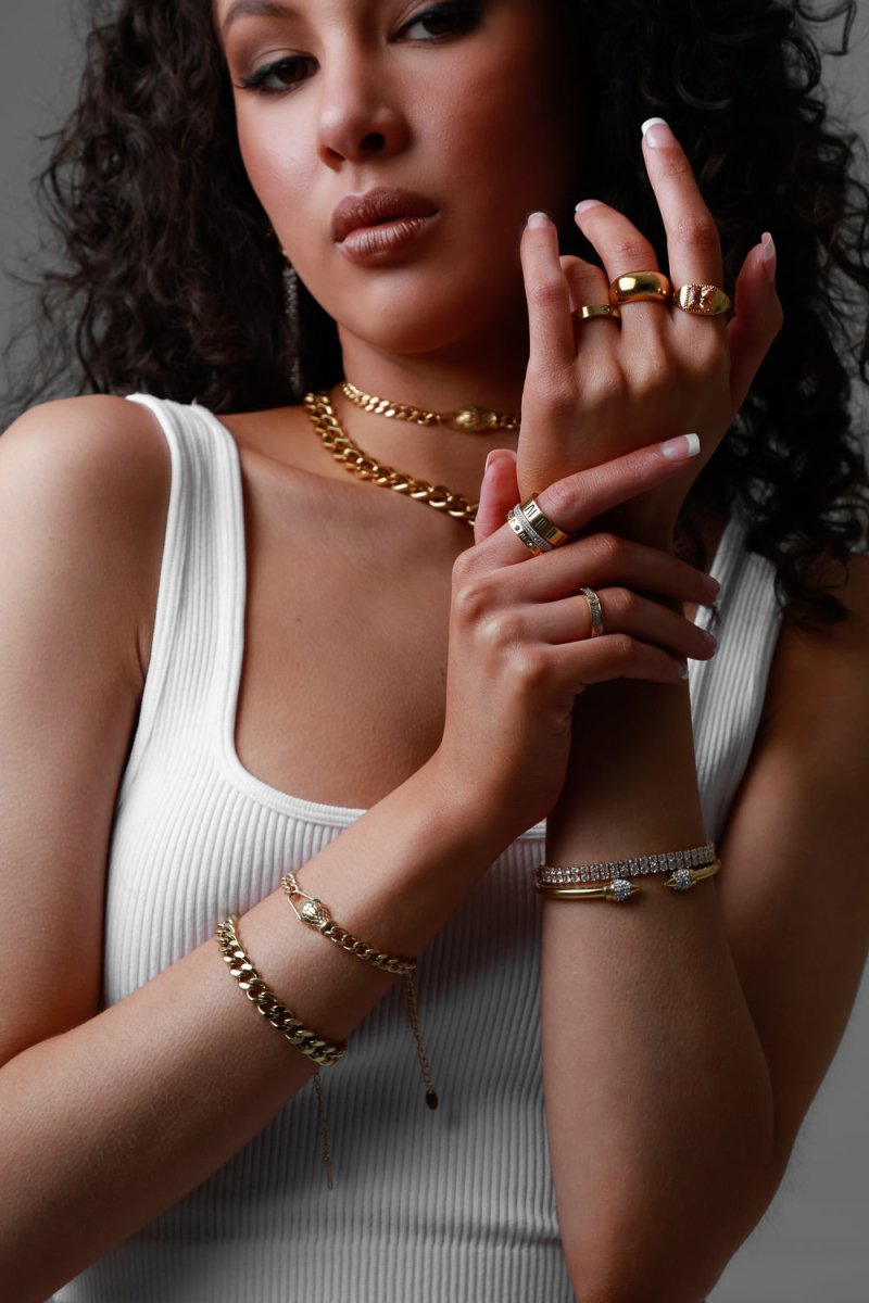 Image of the Snake Bracelet – a bold 18K gold stainless steel bracelet with a sleek serpent design, perfect for edgy and empowered looks.

