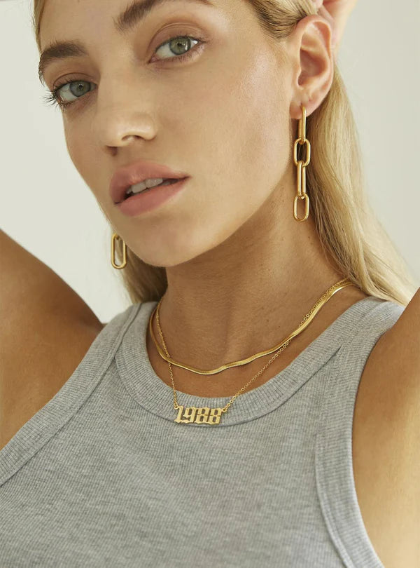 Talia Birth Year Necklace – personalized jewelry featuring a vintage-style year charm.

